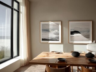 A table with two framed pictures on it. One picture is of the ocean and the other is of a wave