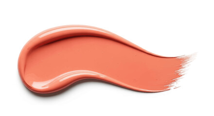 Obraz premium A creamy smear of coral pink lipstick or liquid blush cosmetic product isolated on a white background.