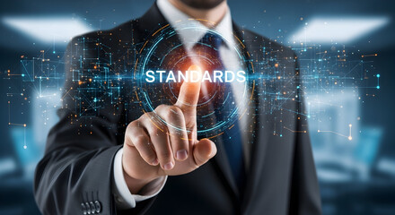 Businessman touching a virtual screen with the word Standards.