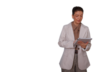 Serious businesswoman using a tablet for work, managing a project on her device, analyzing data. Transparent background