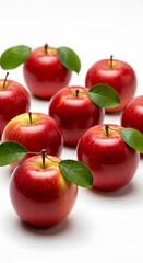 Vibrant Red Apples with Fresh Green Leaves on White Background.