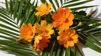 Fototapeta premium Orange flowers and green leaves