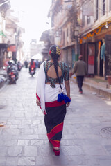 Newari Girl in Traditional Attire Strolling Through Patan Durbar Square