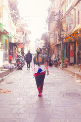 Newari Girl in Traditional Attire Strolling Through Patan Durbar Square