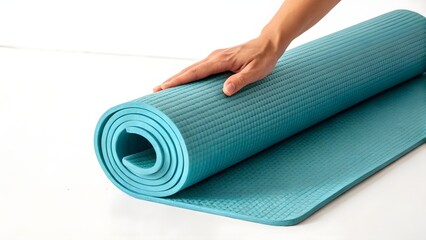 Hand Holding Rolled Yoga Mat on White Background, Fitness and Wellness Preparation Concept