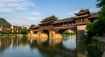 Historic covered bridge with traditional chinese architecture over a river