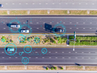 Top view of modern highway with autonomous cars using digital data connections and smart technology for intelligent transportation and traffic management.