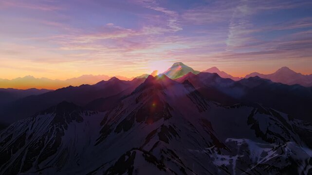 Mountain landscape with snow capped peaks and rugged terrain stretching out at sunset, capturing the serene and untouched wilderness concept of uli while inviting viewers to connect with natures.