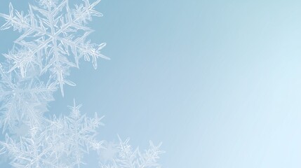 Obraz premium Delicate snowflake design over pastel blue and white gradient, winter background with free space for text