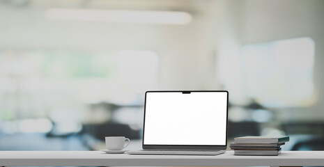 Front view laptop on white table In modern office workplace. 3D render