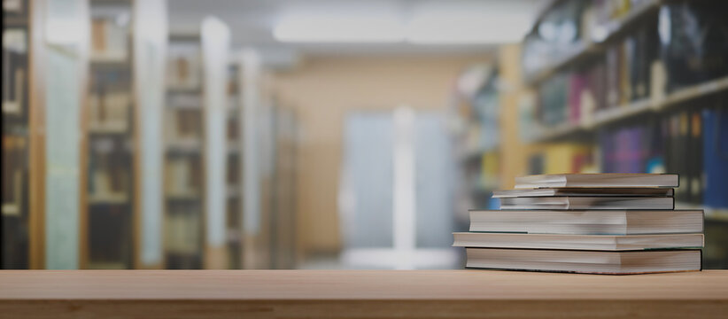 Stack of books on wooden table in library 3D rendering