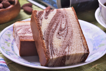 Slices of marble honey spong cake on the plate