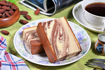 Slices of marble honey spong cake on the plate