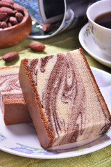 Slices of marble honey spong cake on the plate