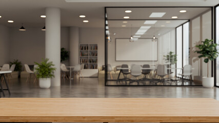 3d render Wooden table with open space office interior skyscraper background