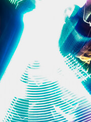 Colorful, fluorescent swirls of light create a dynamic and energetic abstract composition. Blurred streaks of purple, blue, and gold give the impression of rapid, surreal movement.