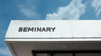 Seminary word sign displayed on a religious or educational building under a clear blue sky, symbolizing theological study, religious education, ministry training, faith, spiritual learning