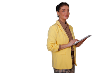 Businesswoman standing, holding tablet, using technology for work, wearing yellow blazer, professional female expertise
