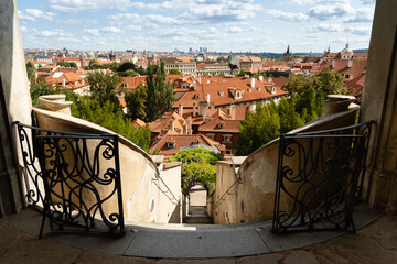 Prague, Czech Republic – August 6, 2025: View from the terrace of the Palace Gardens below Prague Castle, overlooking the red rooftops of Malá Strana, Prague, on a summer day.
