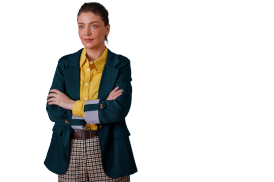 Confident young woman with arms crossed wearing a blazer and plaid pants, standing with a determined expression on transparent background