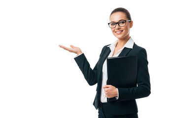 Smiling businesswoman in glasses and suit holding a folder and gesturing with her hand, isolated on transparent background
