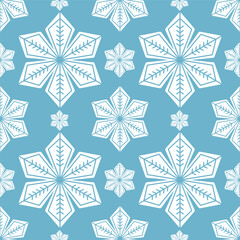 Seamless geometric snowflake pattern on blue background, modern winter design for holiday wrapping paper, textile prints, Christmas cards, wallpapers, and seasonal decorative graphic projects.