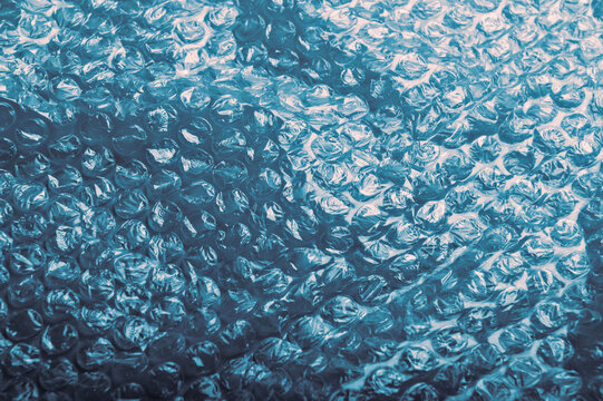 macro view of bubble wrap texture showing protective air-filled cushioning material for fragile product packaging and safe delivery