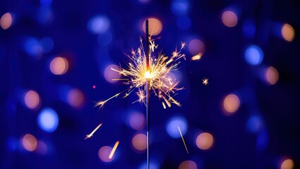 Obraz premium New year sparkler and fireworks on black background