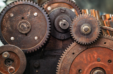 Rusty gear mechanism. Rusty texture, mechanical parts, gears, spare parts, old rusty iron wheels.
