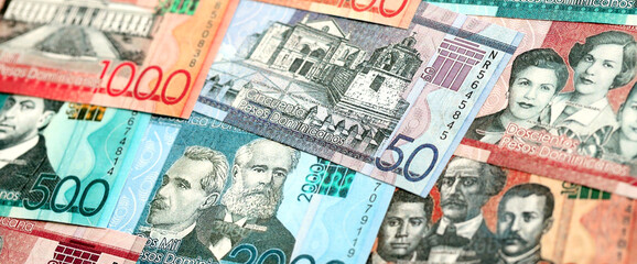 Dominican Republic Pesos currency money bills. DOP currency banknotes in bunch with different denomination close up