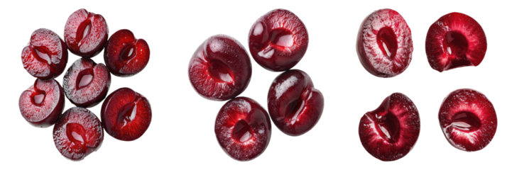 Close-up shot of several cherries arranged on a surface, each cut revealing its red interior and the pit.