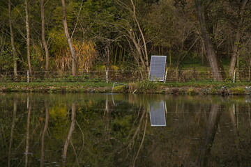 Solar panel at the fish pond at Willersdorf, Oberwart district, Burgenland, Austria, Europe, Central Europe
