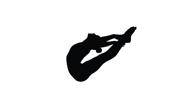 Silhouette of a gymnast performing a backflip on a for artistic purposes