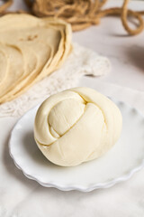 Traditional delicious Oaxaca cheese or Quesillo. Mexican food