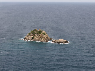 sunny rocky island with azure pools, secluded islet featuring crystalclear waters and granite shores Koh Tao Thailand