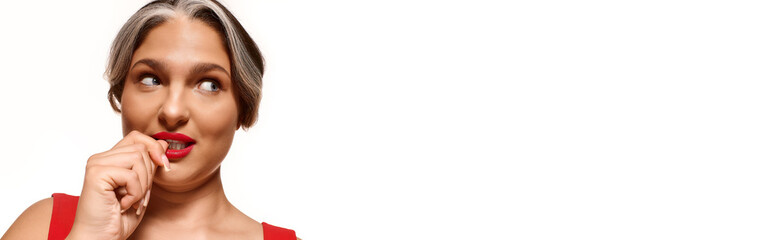 Celebrating uniqueness in beauty with striking red lips and a white forelock