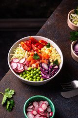 Balanced healthy bowl with vegetables and salmon