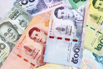 Thai baht currency money bills. The current banknotes lies on table in big amount close up