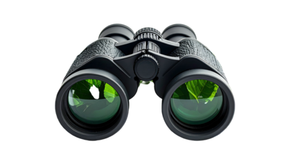 Overhead studio shot of a black pair of binoculars, lenses reflecting green foliage