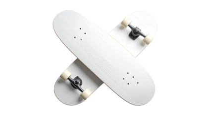 Two white skateboards crossed on a black background. Overhead studio shot