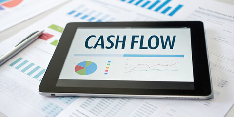 Focused on business cash flow management with financial analysis on digital tablet. report with chart and graph shows data for investment strategy and accounting