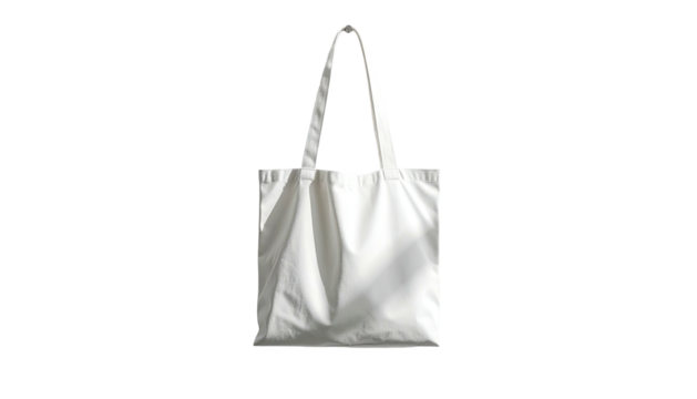 A white cotton tote bag with a pair of rounded handles stands centered on a black background