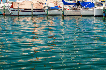 Reflections on the water created of boats