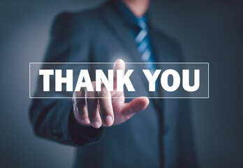 Businessman pointing finger on virtual thank you text, symbolizing appreciation, communication, gratitude, and professional connection in modern business and digital interaction concept.
