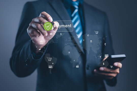 Businessman using smartphone and touching virtual secure payment icon with global financial network, representing online banking, fintech innovation, e-commerce transaction, digital money technology.