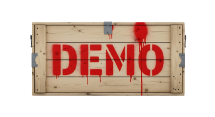 "demo" stenciled red spray paint on textured wooden shipping crate