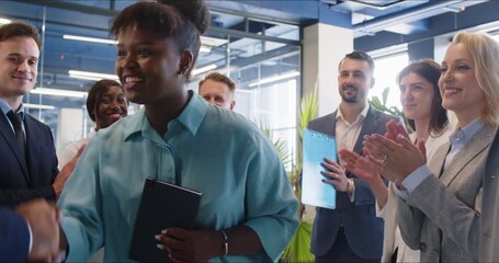 Female black successful business african woman, leader talking to happy diverse employees group at corporate office briefing, new multiracial coworker meet team at meeting, applauding, congratulating - Powered by Adobe