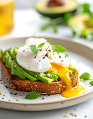Delicious Avocado Toast with Poached Egg and Fresh Basil.