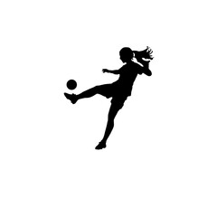 Silhouette of a young girl kicking a soccer ball in mid air with her hair flowing