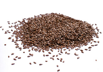 A scattered pile of brown flaxseeds, a healthy superfood, is isolated on a clean white background in India, perfect for culinary and nutritional themes.